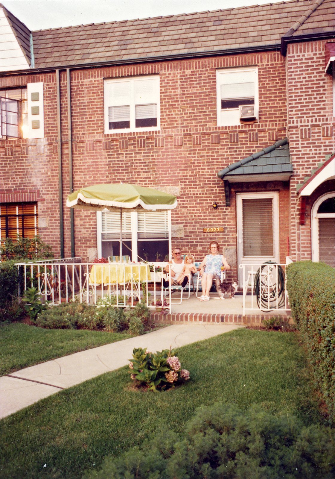 Paddy and Catherine relax on their front patio, Elmhurst, Queens, 1976.