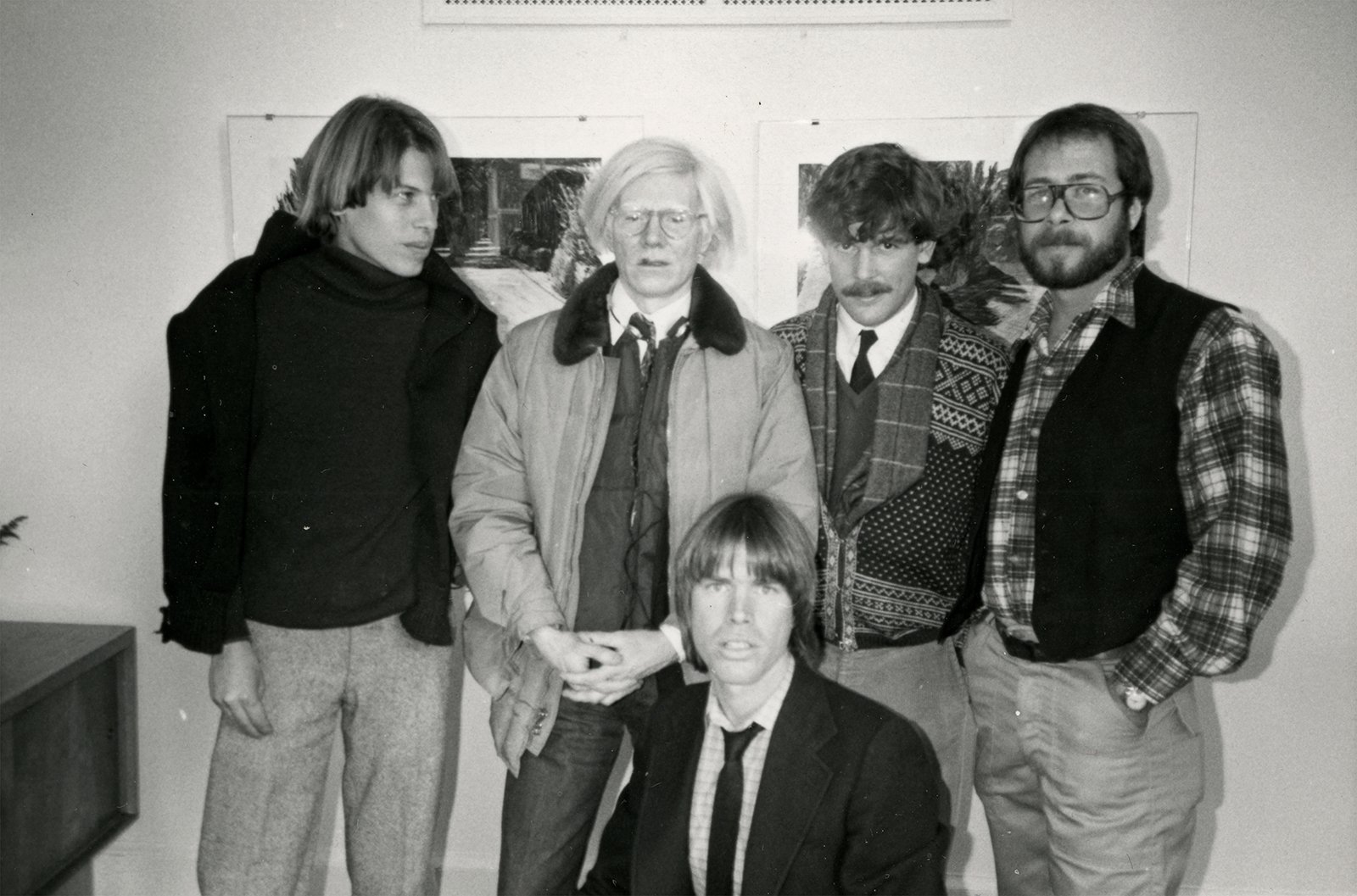 Artists Howard Carr, Andy Warhol, Peter Wise and Martin Kotler, with Chris Murray (front), at the launch of Peter Wise’s exhibition at the Govinda Gallery, 1984.