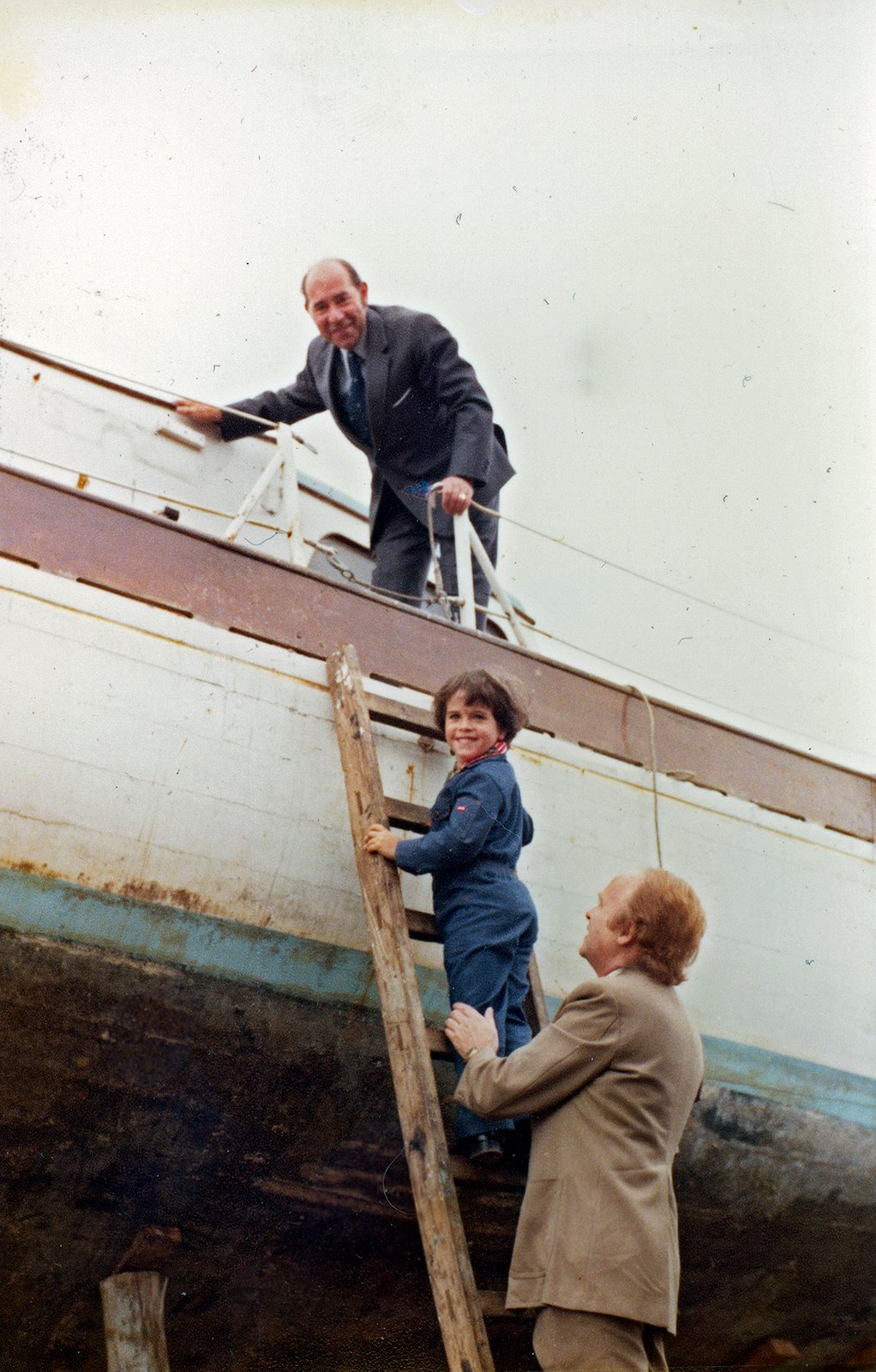 Navy officer and Erskine C. Childers, with Erskine B. Childers on the ladder, 1979.