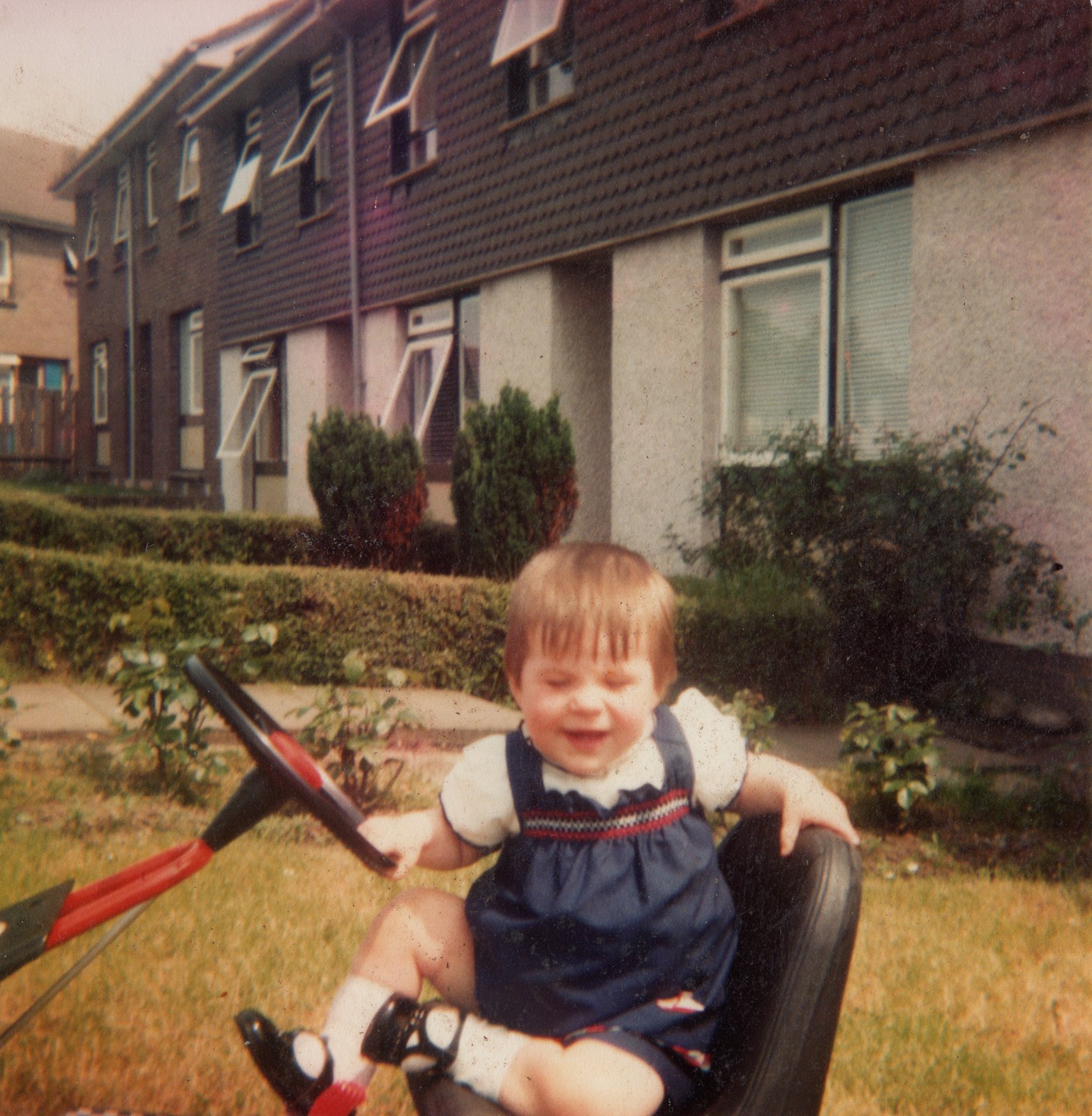 Lisa Crowne playing outside the family home in Strathroy, County Tyrone, in 1983.