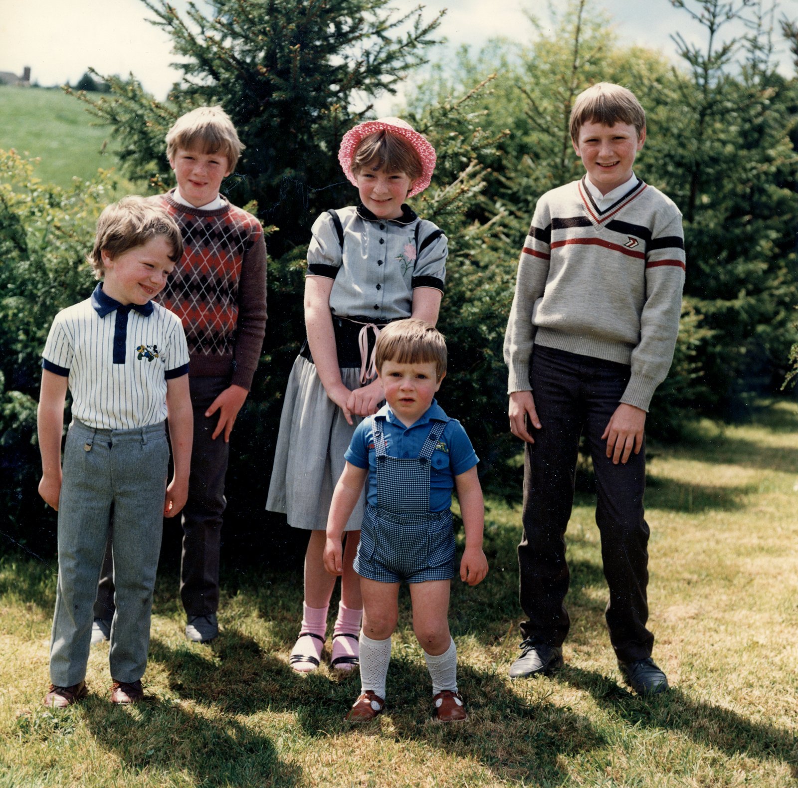 Griffin family group posing in a back garden.