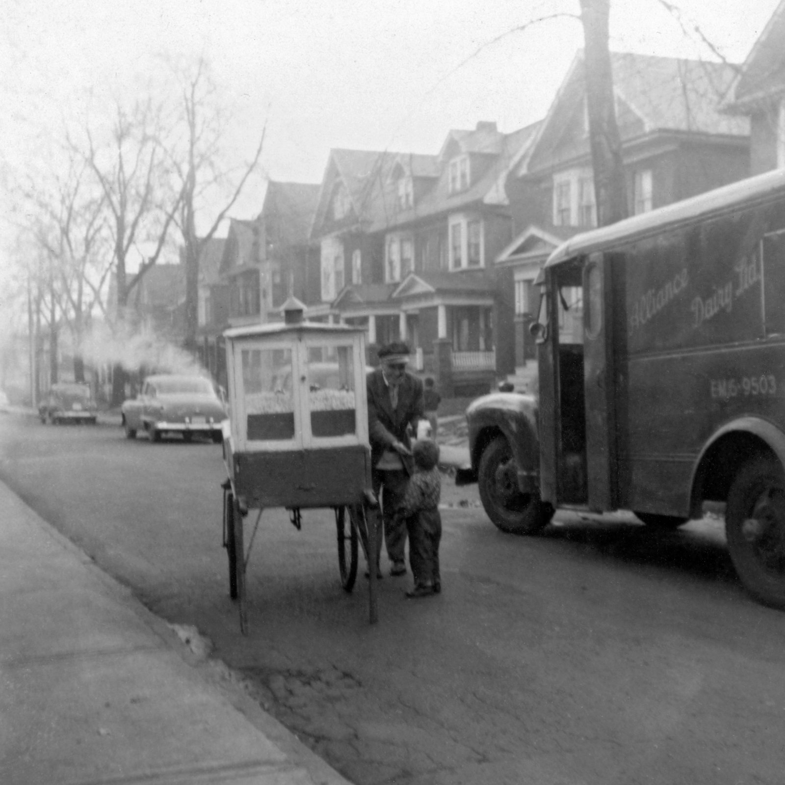 Neil buying pop-corn, Cowan Ave, Toronto, November 1956.