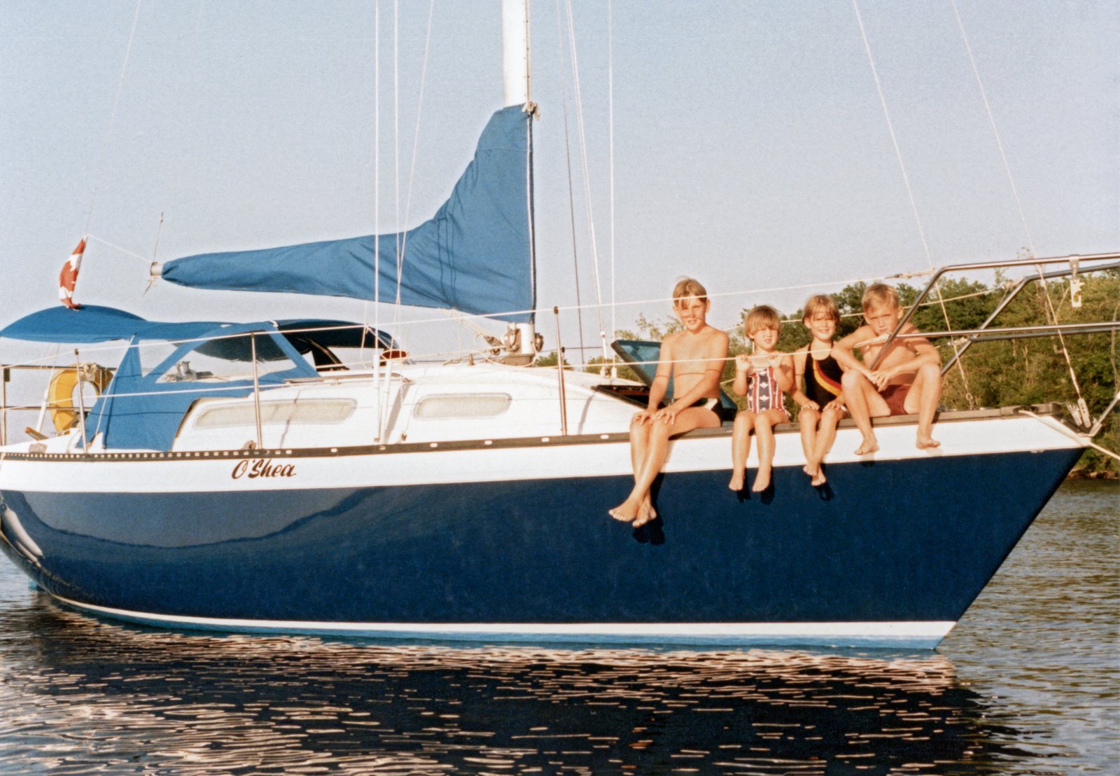 The Shea siblings on their family’s O’Shea sailboat, Ontario, circa 1984.