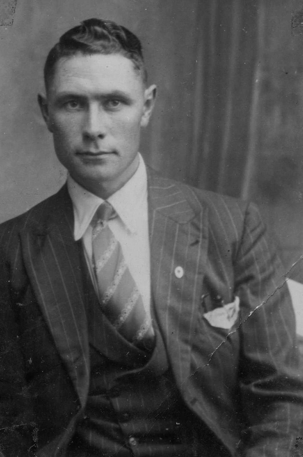 This is the only known surviving photograph of John McGing as an adult. This image illustrates him in a London studio having a formal portrait taken.