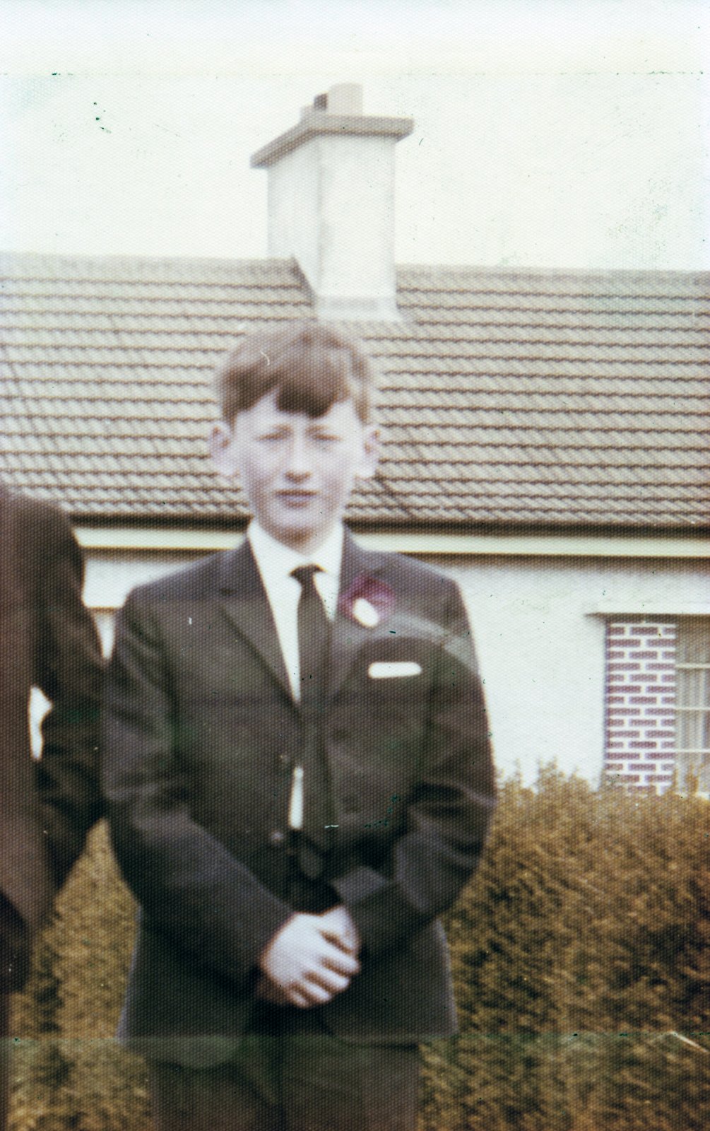 Confirmation photo of Austin McGing Junior taken at his house (Irish Land Commission in style) in Moynalvey, County Meath c. 1970.