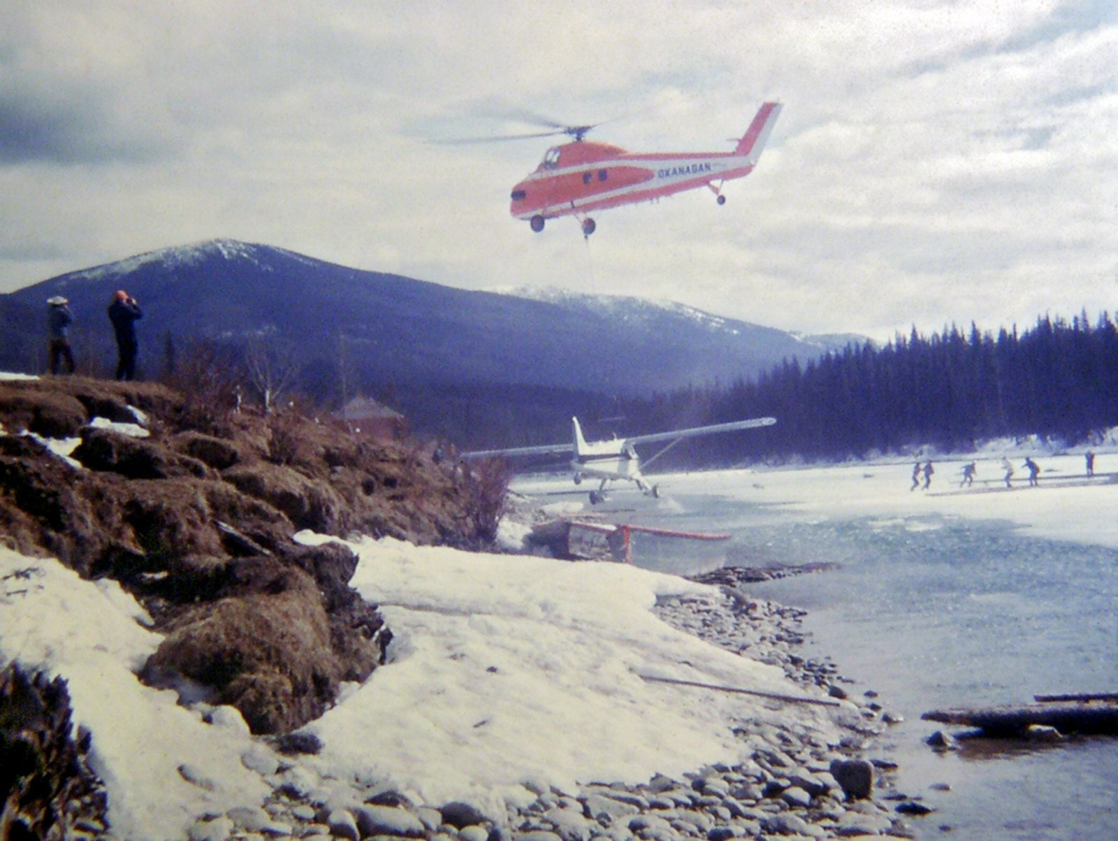 Helicopter is brought in to move the plane back on to the ice, March 1973.